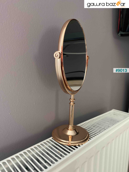 مرآة مكياج دائرية ومكبرة على الوجهين واقفة باللون الذهبي الوردي