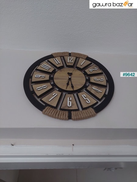 ساعة حائط مزخرفة بحبل خشبي